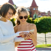 Parent and Teen On Mobile Device