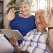 Grandparents Waving at Tablet Image