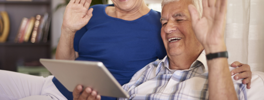 Grandparents Waving at Tablet Image