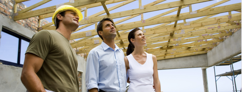 couple talking to custom home builder